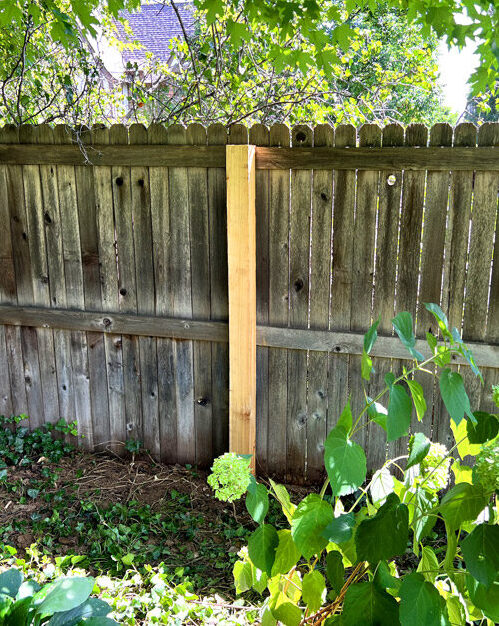 Cedar wood privacy fence post repair in Hill Top neighborhood in Denver, Colorado.