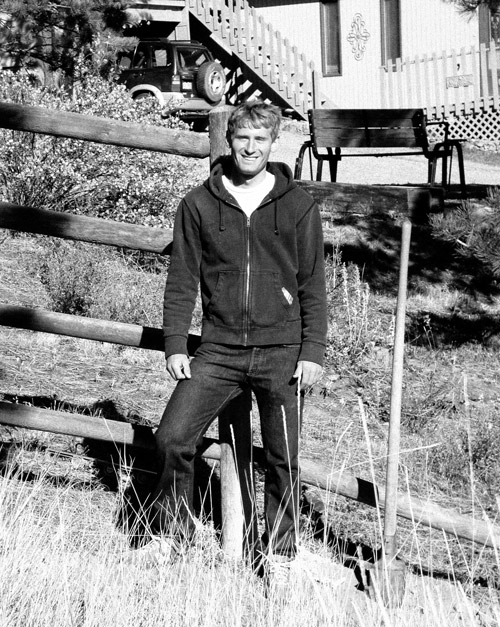 Owner of Fence Repair of Denver, Kelly building a round rail fence in Nederland, Colorado.