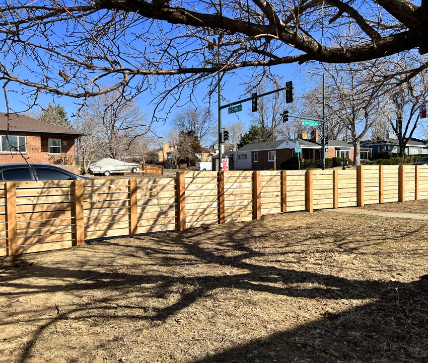 Modern horizontal wood front yard fence from inside corner in Sloans Lake neighborhood in Denver, Colorado.