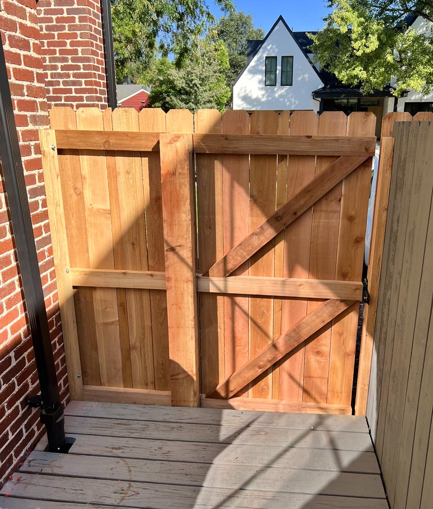 Inside framing of wood fence gate and post repair with self closing hinges in Denver, Colorado.