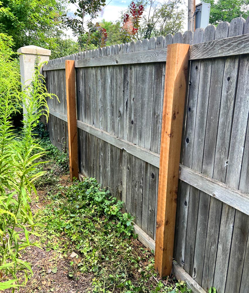 Cedar wood privacy fence post repair in Hill Top neighborhood in Denver, Colorado.