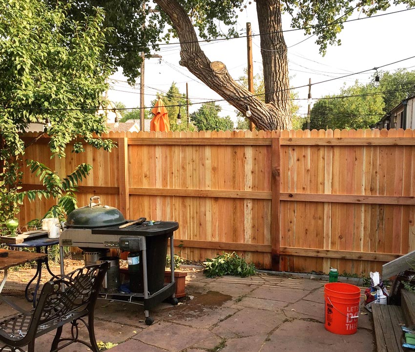 New cedar wood privacy picket fence in Washington Park neighborhood in Denver, Colorado.