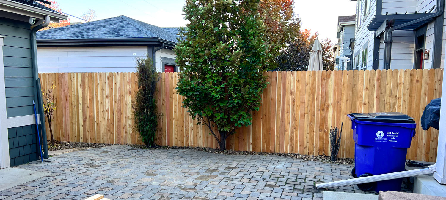 Shared dog ear privacy fence in South Pearl neighborhood in Denver, Colorado.