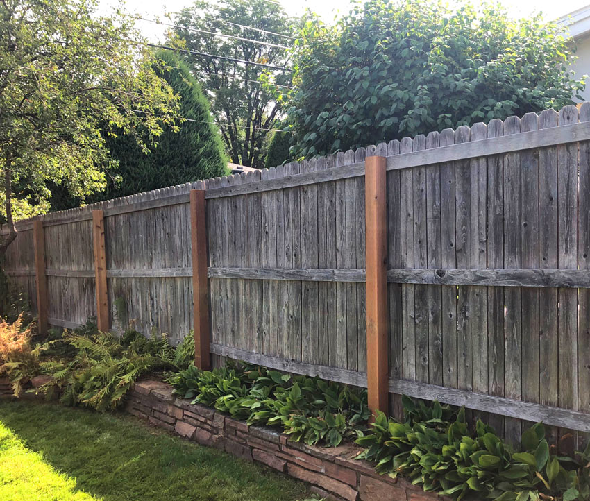 Weathered cedar wood fence post replacement in Denver, Colorado.