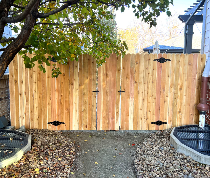 Secure front wing wood fence gate in South Pearl neighborhood in Denver, Colorado.