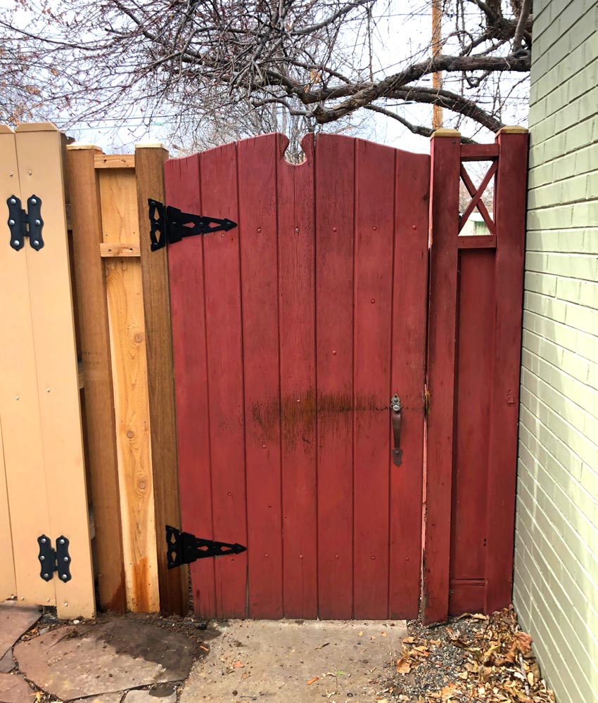 Existing wood fence gate hinge post repair in Denver, Colorado.