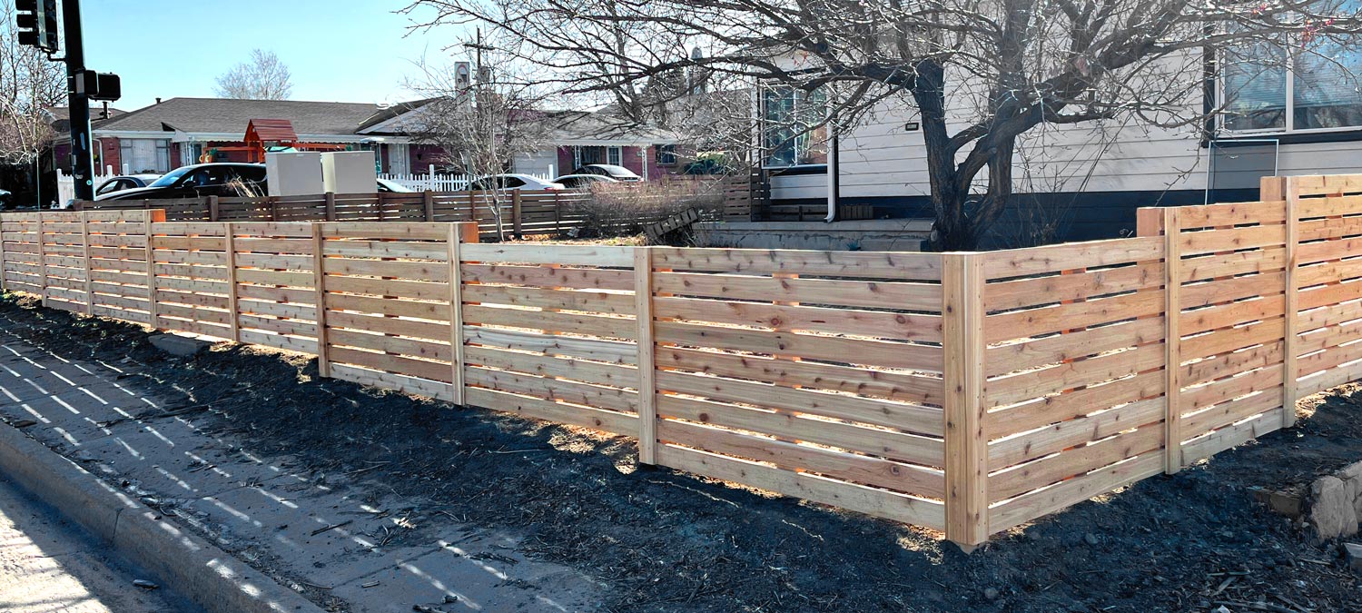 Modern horizontal wood front yard fence from corner in Sloans Lake neighborhood in Denver, Colorado.