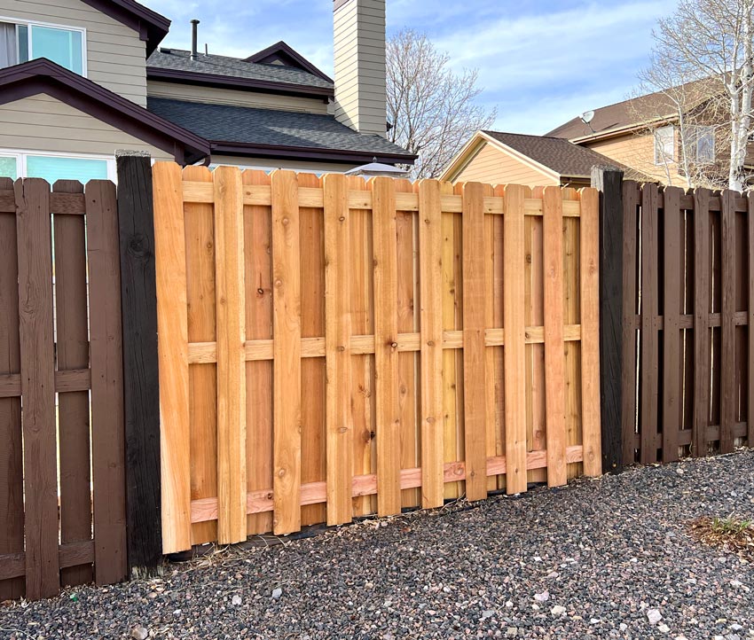 Cedar wood shadow box picket fence section repair in Lakewood, Colorado.