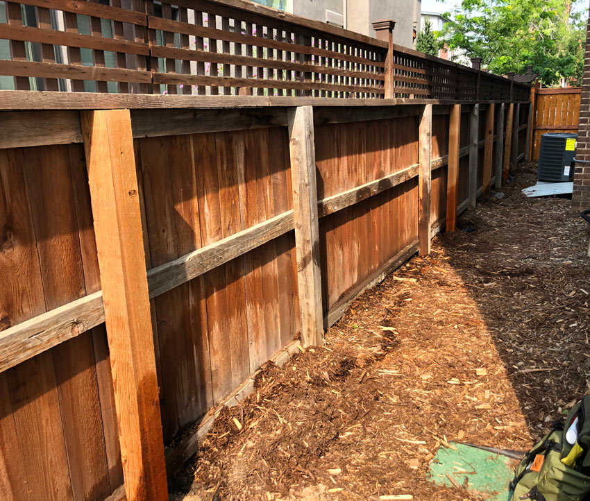 Cedar lattice wood fence post repair in Denver, Colorado.