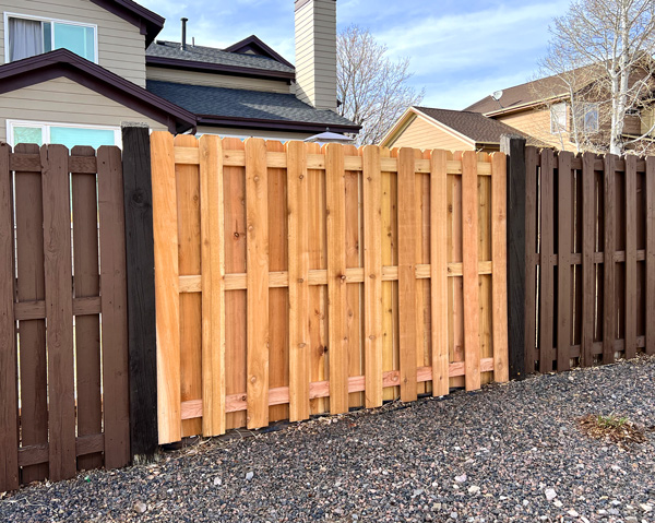 Shadow box cedar wood fence section repair in Rooney Valley near Denver, Colorado.