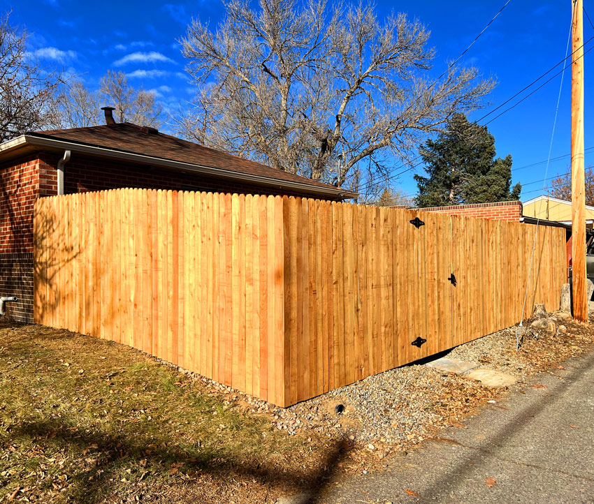 Cedar wood picket fence along alley in Wheat Ridge, Denver, Colorado.