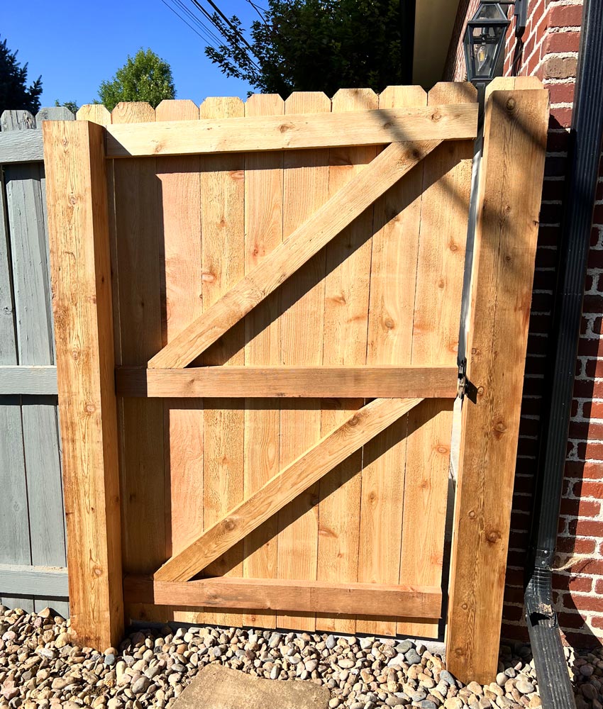 Cedar wood fence gate replacement with self closing hinges in Denver, Colorado.