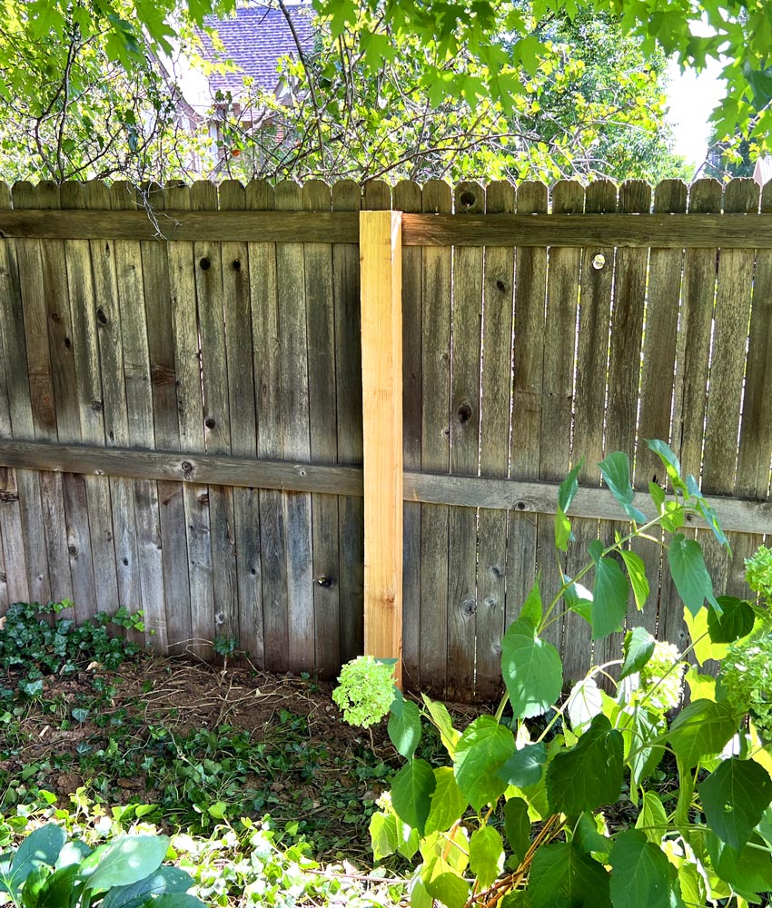 Cedar wood privacy fence post repair in Hill Top neighborhood in Denver, Colorado.