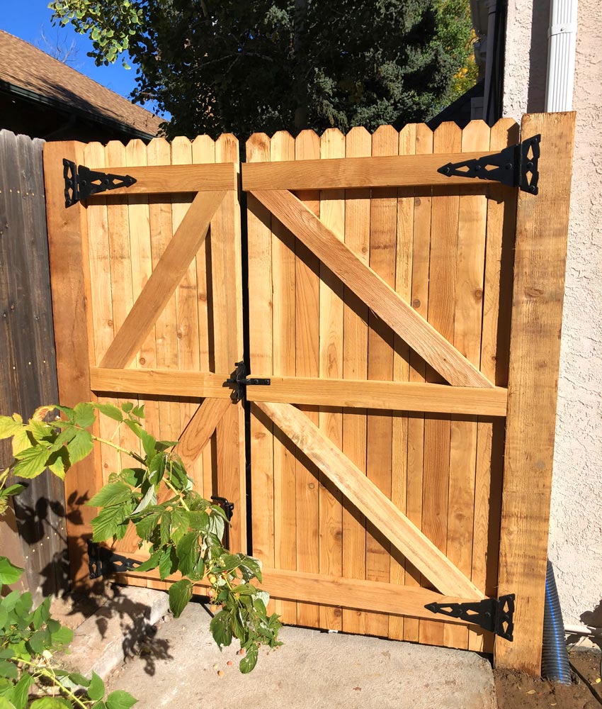 Cedar wood double swing gate in Denver, Colorado.