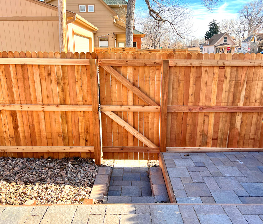 Cedar wood fence gate area along alley in Wheat Ridge, Denver, Colorado.