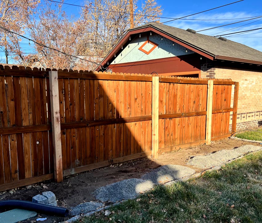 Cedar wood fence post repair in Denver, Colorado.